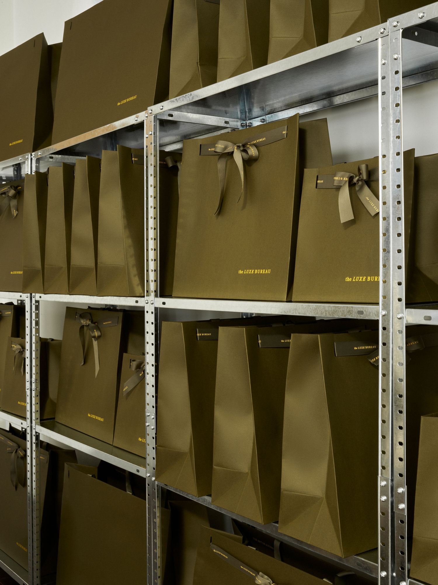 Luxury retail carrier bags, Progress Packaging, The Luxe Bureau, bespoke bubble print ribbon handle, sustainable materials, bespoke finishes, gold foil branding 1