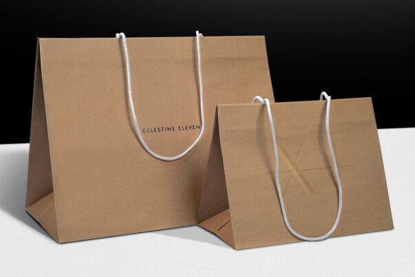 Custom paper carrier bag with long handles, bespoke packaging printing and production