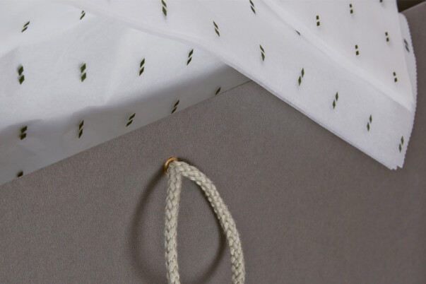 Custom paper bags with tissue lining, luxury paper bags production by Progress Packaging