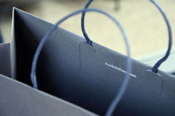 Custom paper carrier bag with twist handles, bespoke packaging printing and production